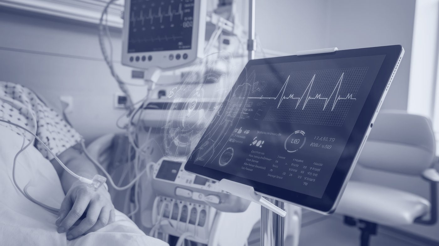 Clinical monitoring systems beside a patient in a hospital ward