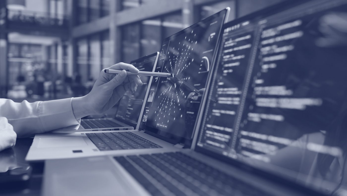 Engineers reviewing an agent system across multiple laptops